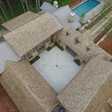 Aerial view of a courtyard surrounded by wooden buildings.