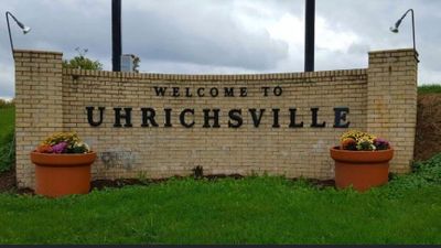 Welcome to Uhrichsville displayed on a brick wall
