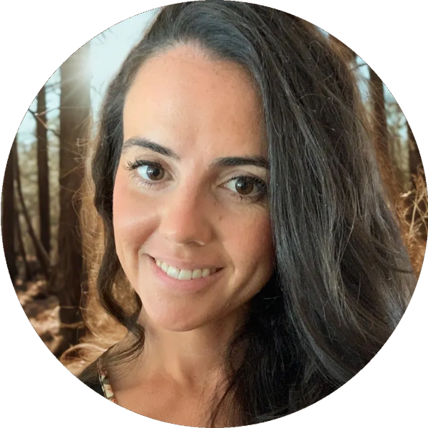 Picture of Cailie Vilardo, white female with brown hair and brown eyes, with a forest background.