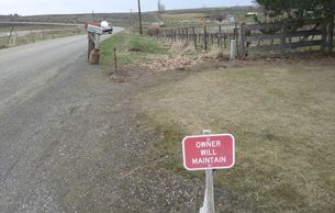 Roadside "Owner Will Maintain" sign