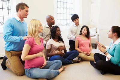 Pregnant women and their partners in a prenatal class.