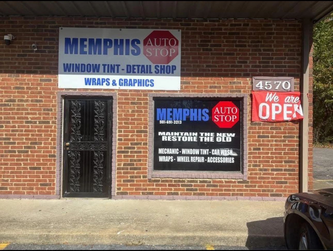 Exterior of Memphis Auto Stop offering window tint, car wash, and repairs.