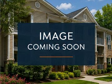 Placeholder image with 'Image Coming Soon' text over a residential building background.