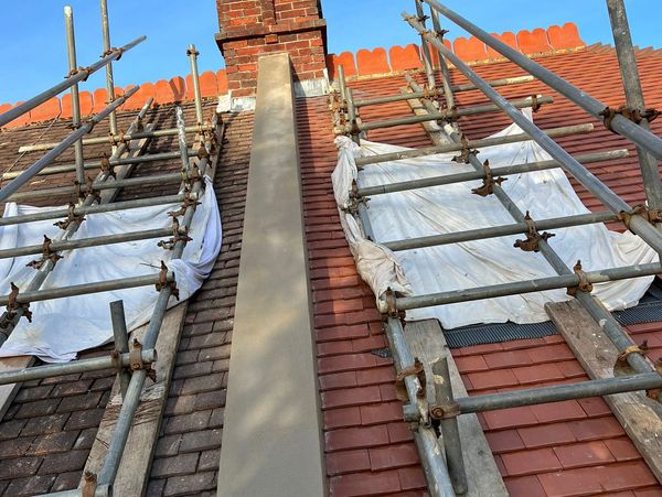 Full firewall re-render using traditional materials in Hove, East Sussex.