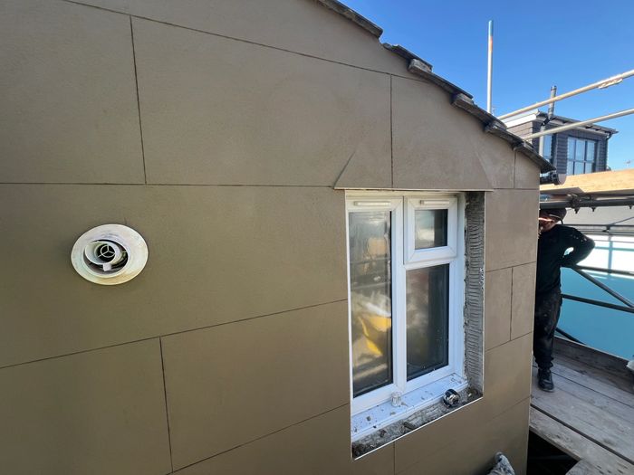 Traditional sand and cement with lime render with ashlar block-marking in Brighton, East Sussex.