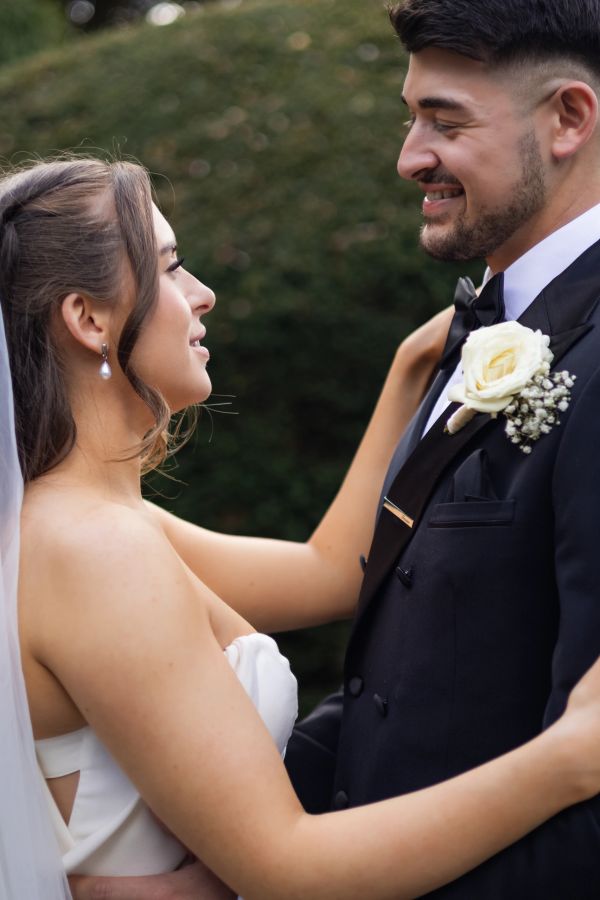Bride and groom sharing a loving moment on their wedding day.