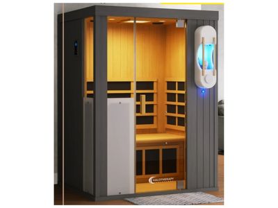 Modern infrared sauna cabin with wooden interior and glass door.