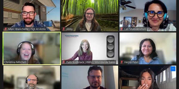 A virtual team meeting with nine participants in grid view.