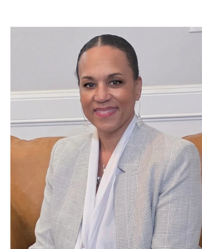 A vibrant city skyline at sunset with reflected colors on water.