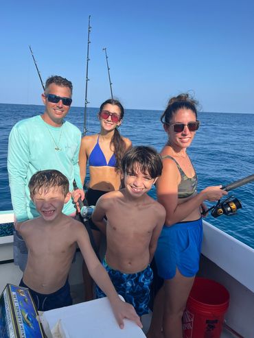 Family fishing trip on a sunny day.