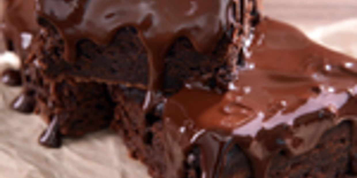 Close-up of chocolate brownies with melted chocolate on top.