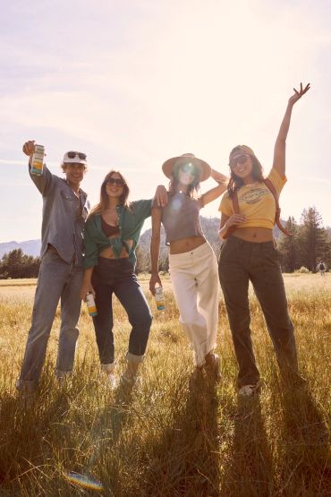 Group of friends enjoying a sunny day outdoors.