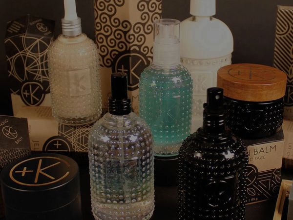 Assorted skincare bottles and containers with textured surfaces.