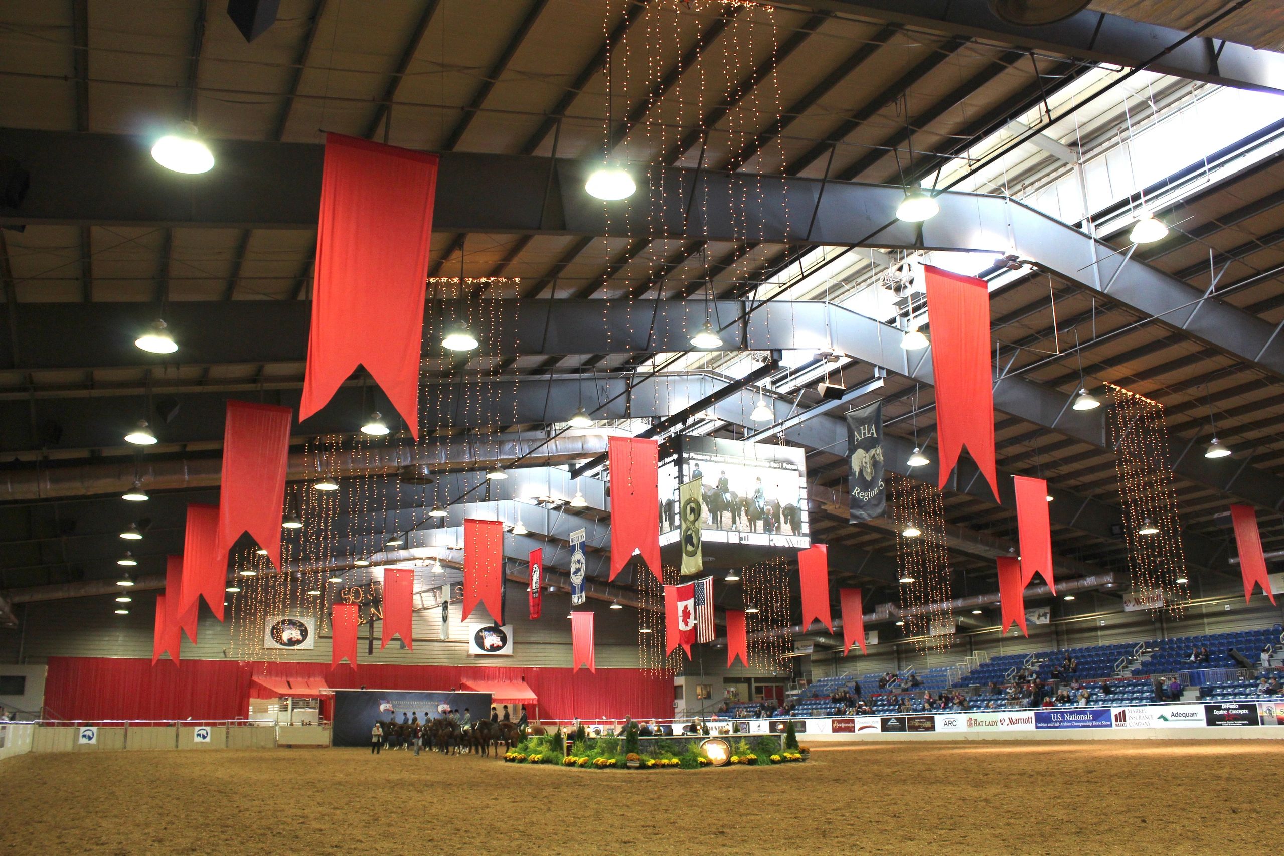 Hanging arena banners at the Arabian & Half Arabian Championship Horse Show