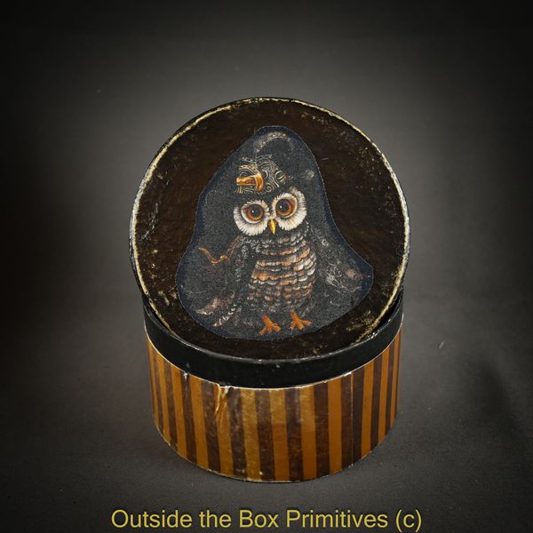 Vintage round box with an owl illustration on the lid.