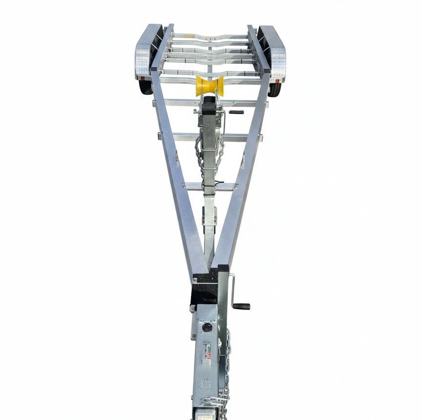 Metal trailer frame with wheels and a yellow roller, isolated on white.