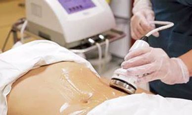 Woman Doing Ultrasonic Cavitation Treatment