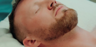 Man Doing a Men's Hot Towel Facial Treatment