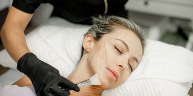 Woman Giving Aesthetica MD Cypress's Signature MD Facial