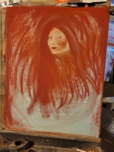 Abstract painting of a woman's face emerging from swirling red strokes.