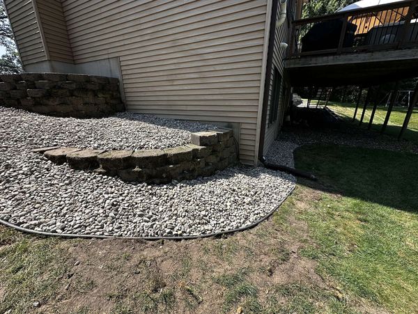 Retaining Wall and River Rock install done by HammerTime Landscaping in Stillwater, MN.