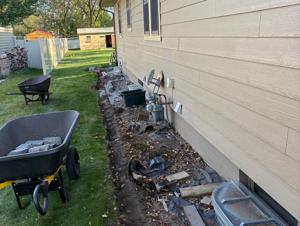 Bullet Edging and River Rock install by HammerTime Landscaping LLC in Winona, MN.