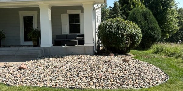River Rock install by HammerTime Landscaping LLC in Lake Elmo, MN.