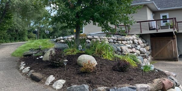 Mulch install by HammerTime Landscaping in Stillwater.