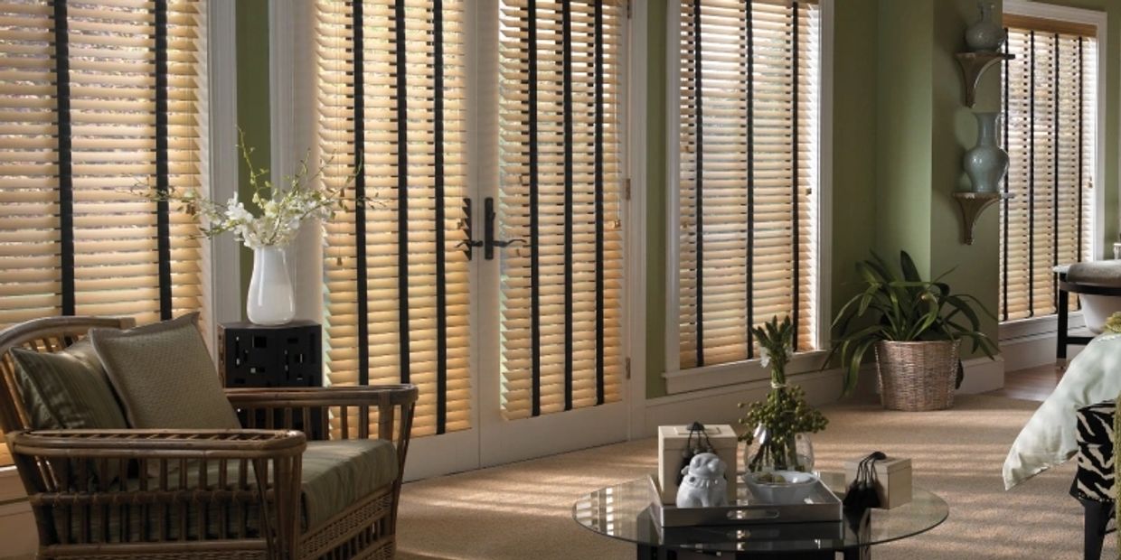 Fauxwood Blinds, great and affordable window treatments, over a living room in Panama City Florida