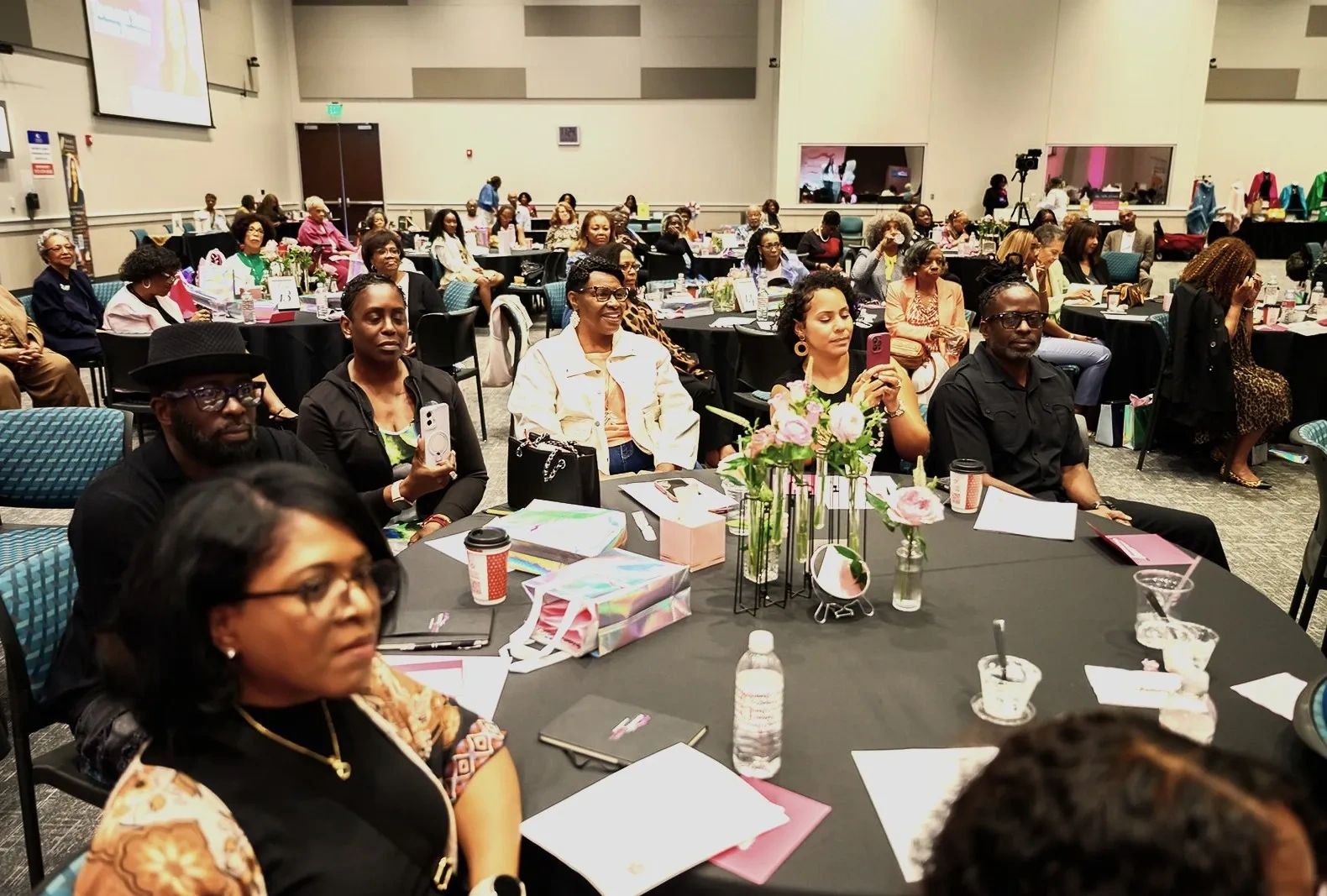 A diverse group of people engaged in an informative presentation.