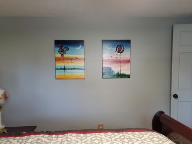 Two paintings in one bedroom. 