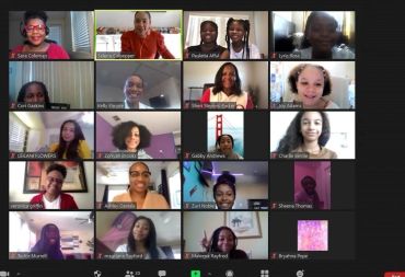 A diverse group of people in a virtual Zoom meeting session.