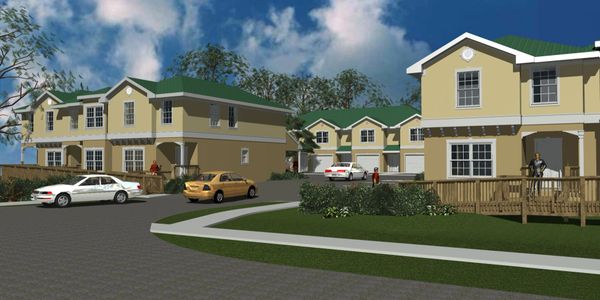 Residential neighborhood with yellow houses and parked cars under a blue sky.
