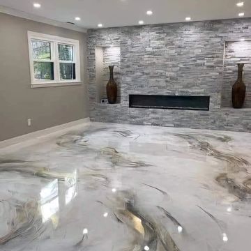 Modern room with glossy marble floor and textured stone wall.