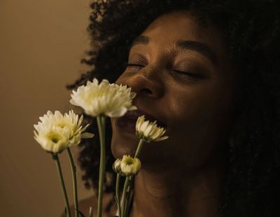 woman smelling flowers