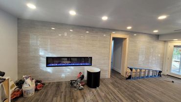 Custom Fireplace full living room remodel new flooring luxury vinyl