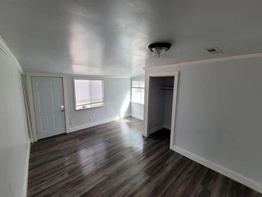 Garage conversion to bedroom luxury vinyl flooring bedroom remodel