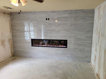 custom fireplace livingroom remodel, custom tile work, luxury vinyl plank