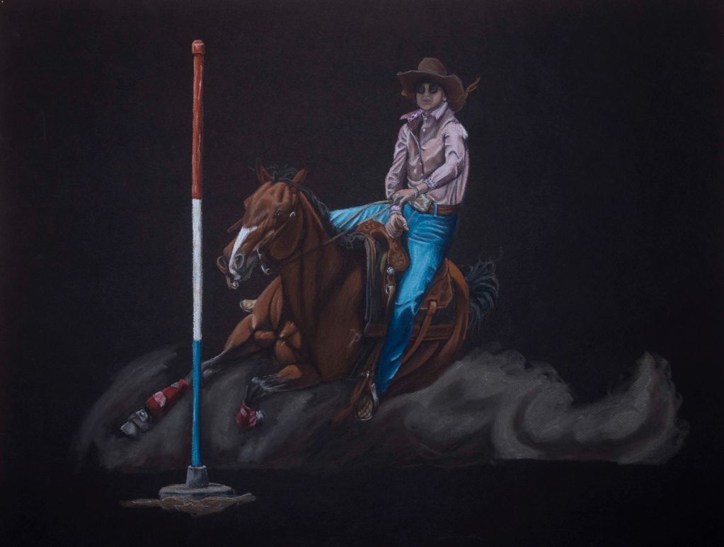 Cowboy on horseback performing a sharp turn near a colored pole.