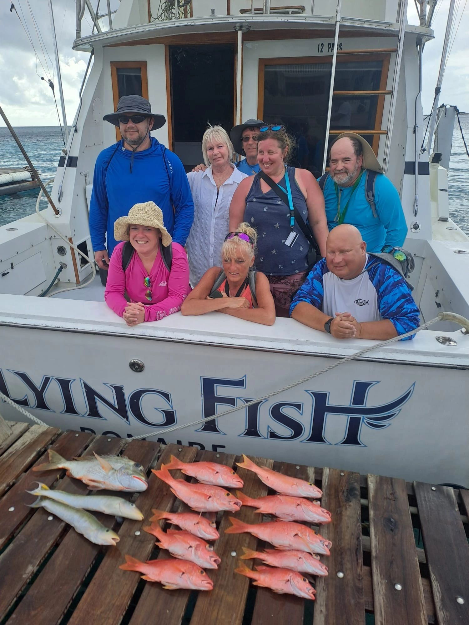 Enjoying our Catches after Booking A Fishing Charter with Flying Fish Chaters in Bonaire