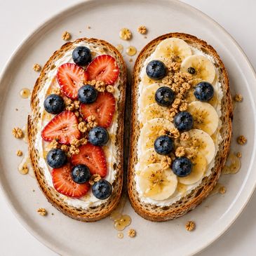Two toasted sourdough slices layered with cream cheese, fresh fruit (Strawberry, Banana, Berry, gran