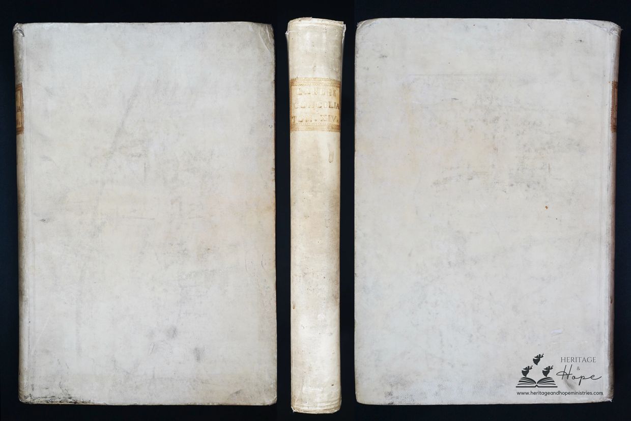 Photo of the front, spine and back of the Sacrosancta Concilia. It is white in color with scuffs