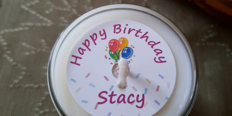 Birthday candle labeled Stacy with balloons.