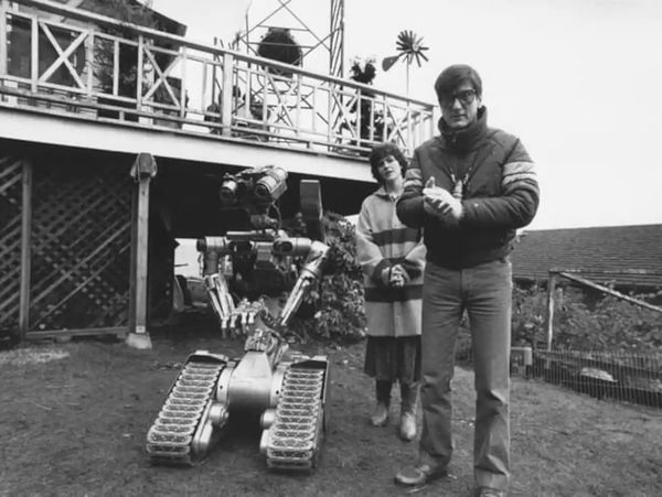 Number 5, Ally Sheedy, and director John Badham in the front yard during filming.
