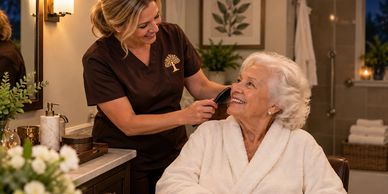 Caregiver combs elderly woman's hair in cozy room.