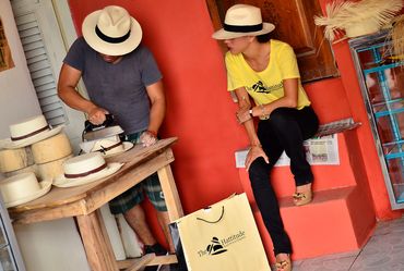 Ironing the hats after hammering them.