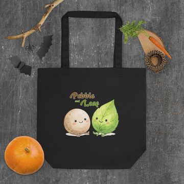 Black tote bag with cute pebble and leaf cartoon design.