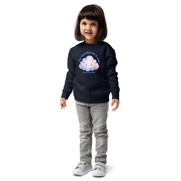 Young girl wearing a dark sweatshirt with a cloud design.