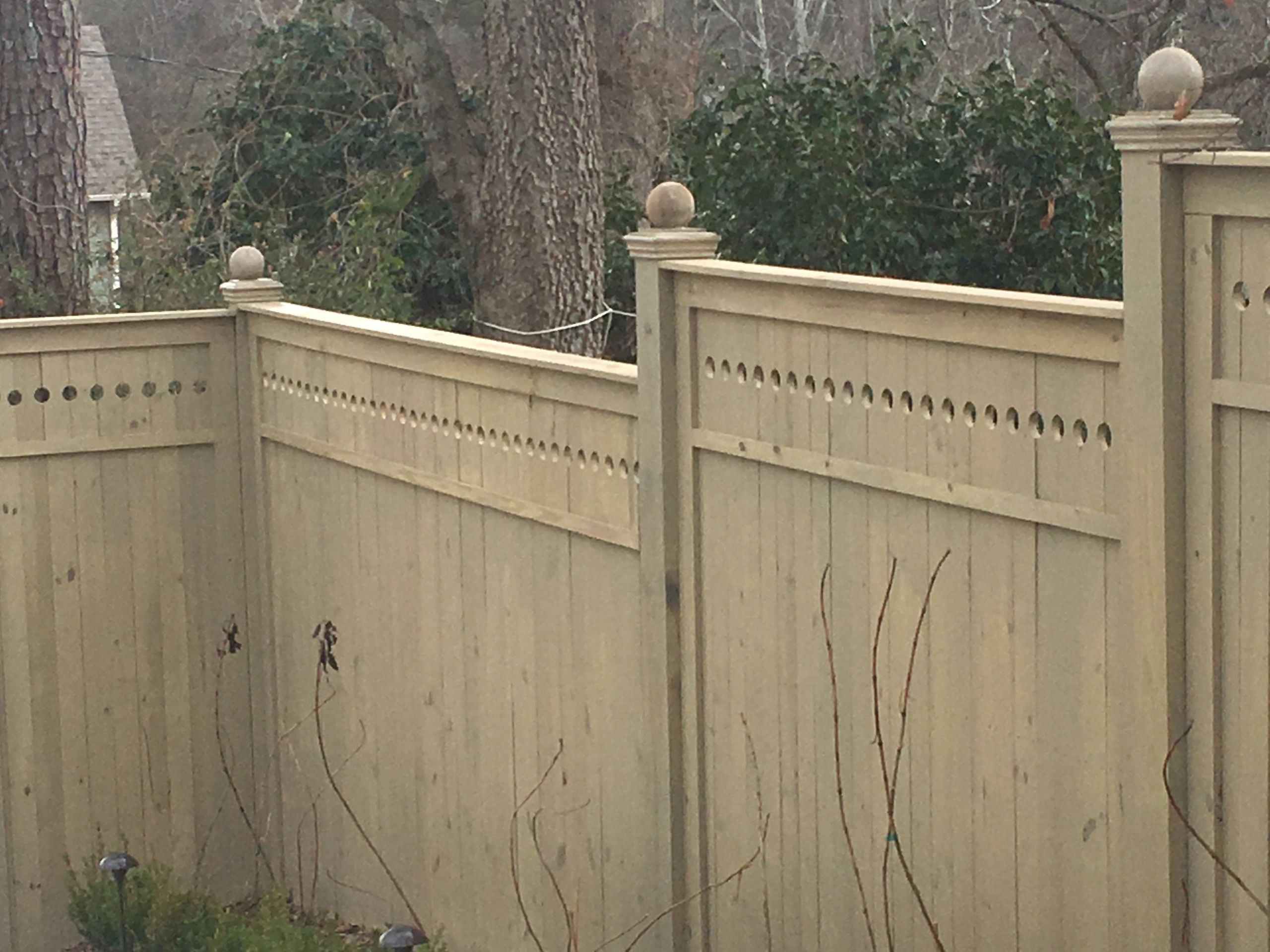 Decorative beige wooden fence.