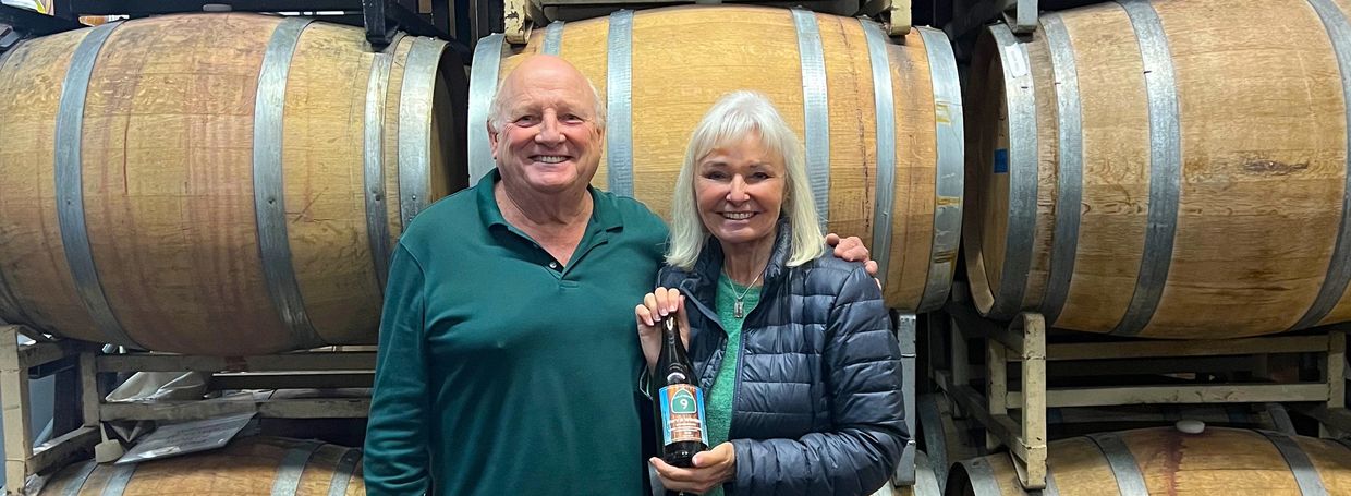 Donna and Grant at the wine barrel room